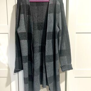 Like new. Knee length black and gray plaid sweater cardigan